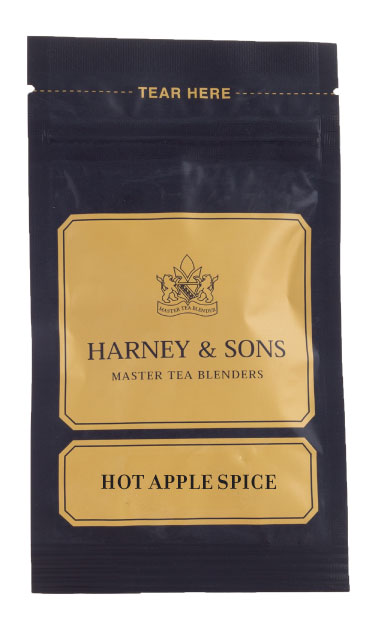 Harney & Sons Hot Apple Spice tea packet featuring a black design with gold accents and branding.