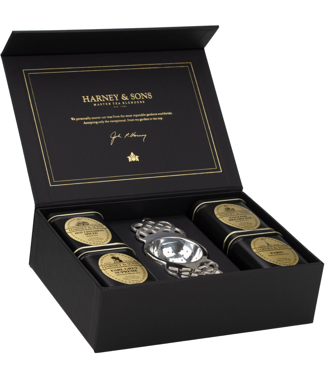 Harney & Sons tea chest featuring loose teas, elegant packaging, and a silver tea infuser inside.