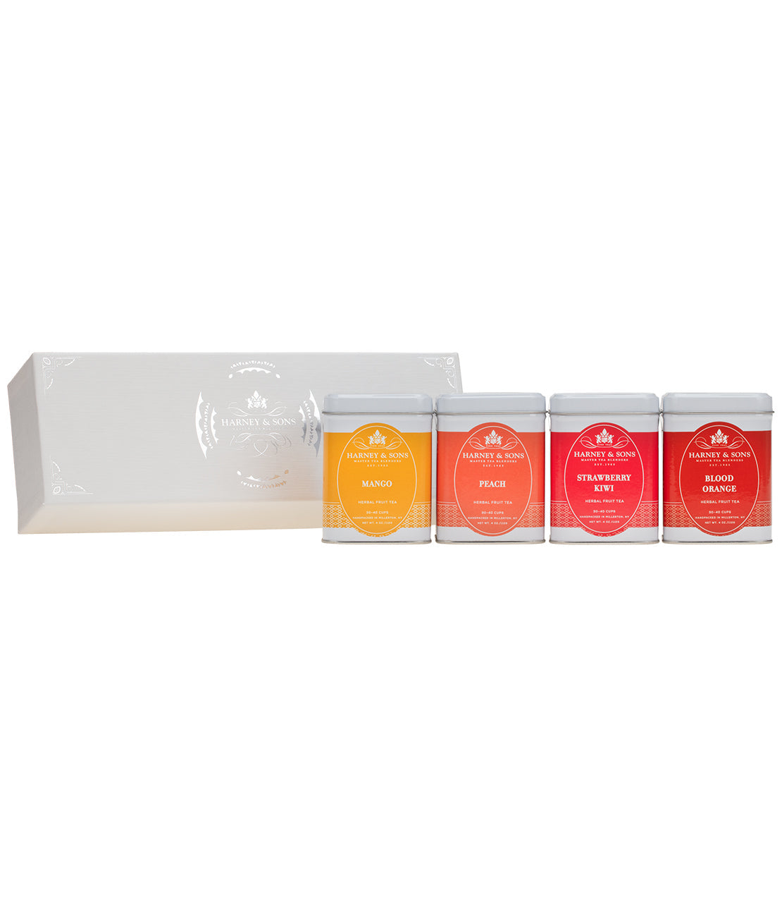 Harney & Sons Fruit Loose Teas sampler featuring mango, peach, strawberry, and blood orange in decorative tins.