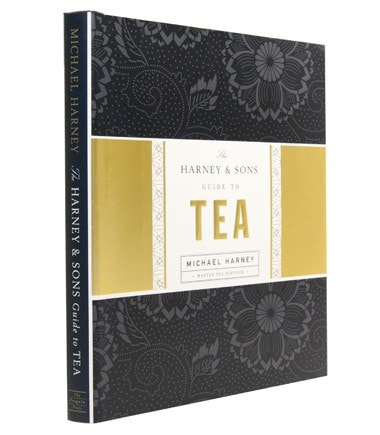 Signed copy of "The Harney & Sons Guide to Tea" by Michael Harney, featuring an elegant black and gold cover design.