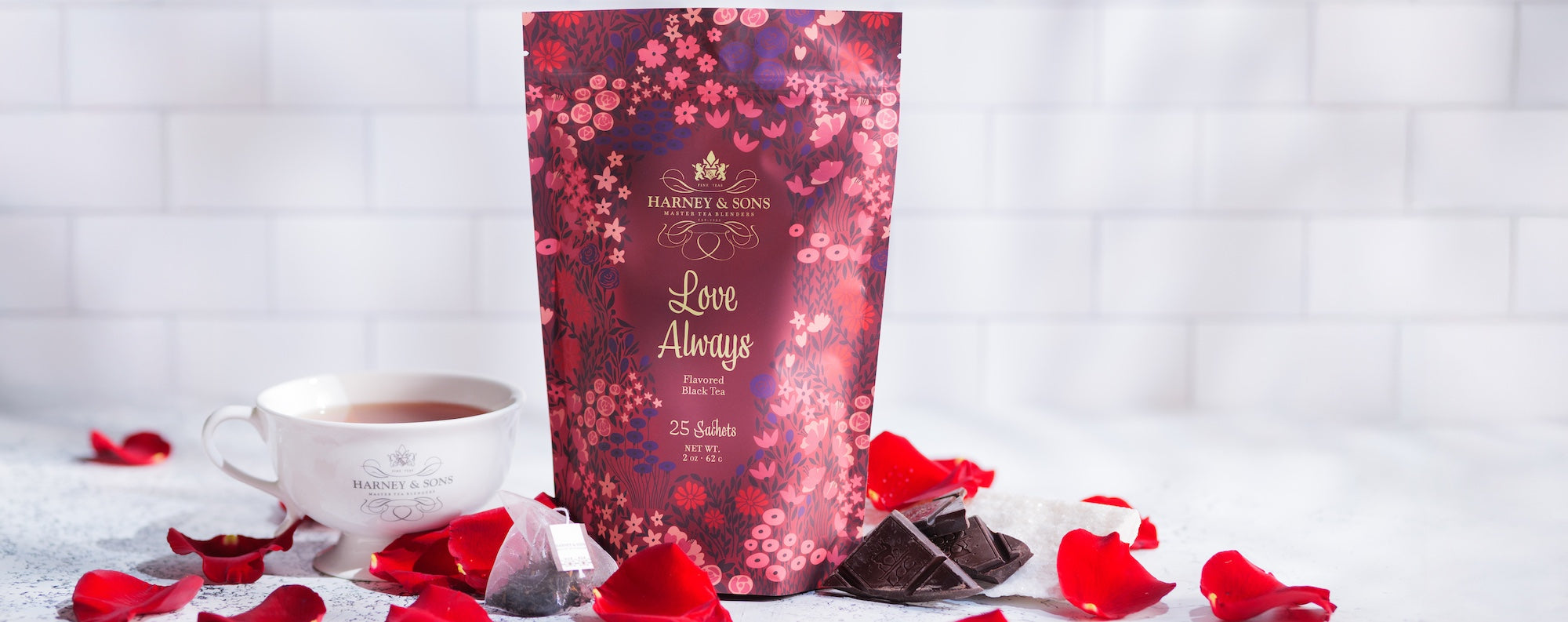 Love Always Bag of 25 sachets on a white background with tea and rose petals.