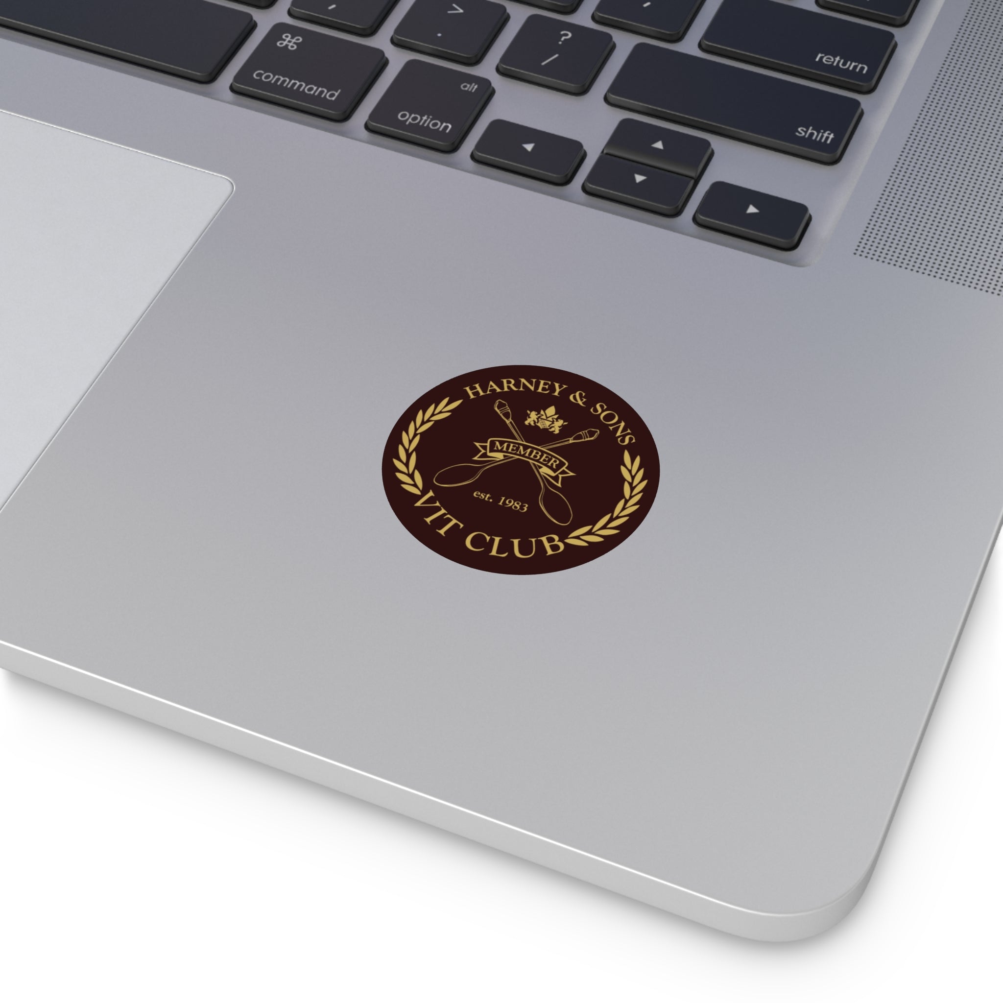 Round vinyl sticker featuring "VIT Club" logo on a laptop, designed by Harney & Sons.