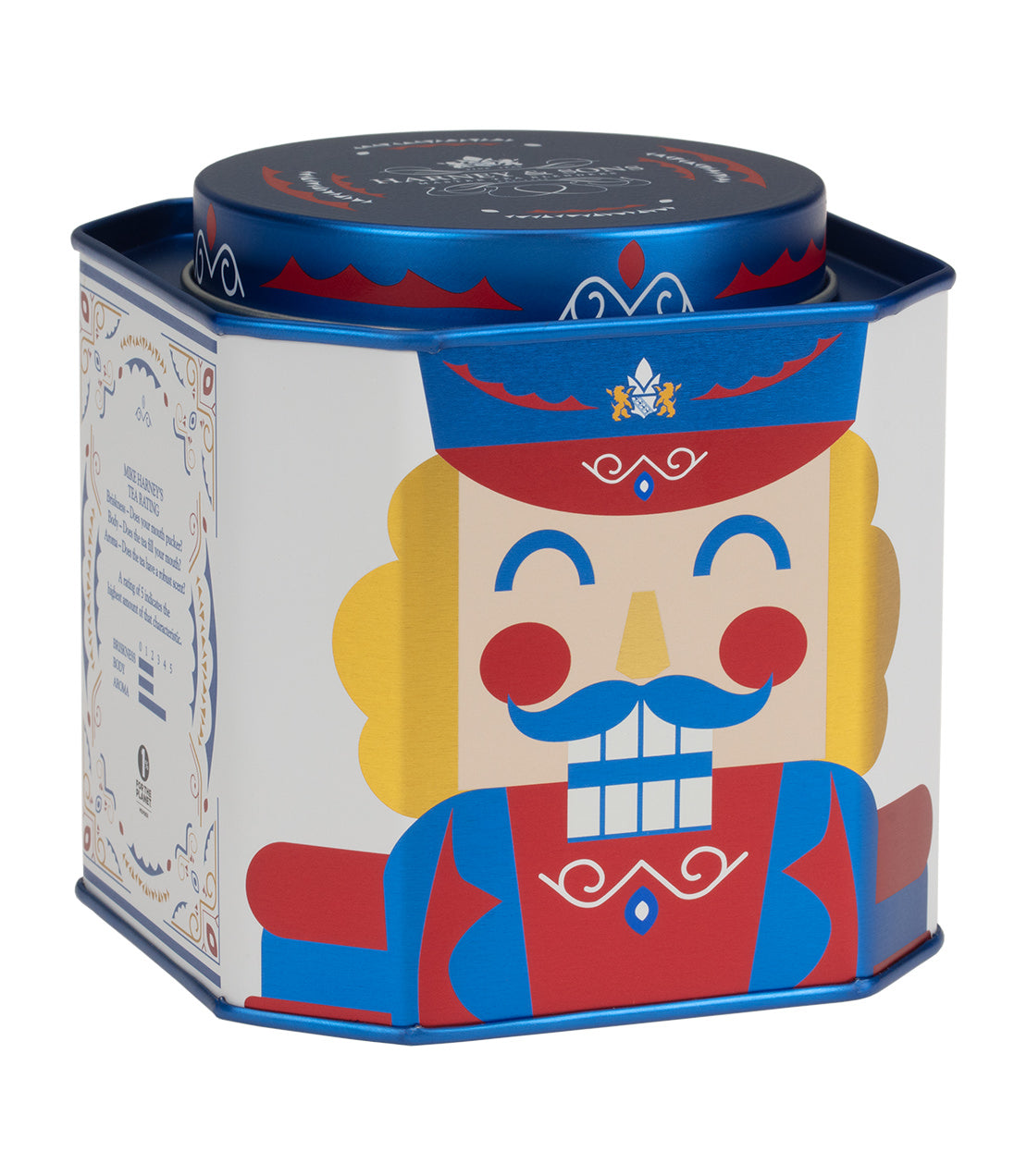 Colorful tin of Nutcracker Blend tea featuring a whimsical nutcracker design, containing 30 sachets.