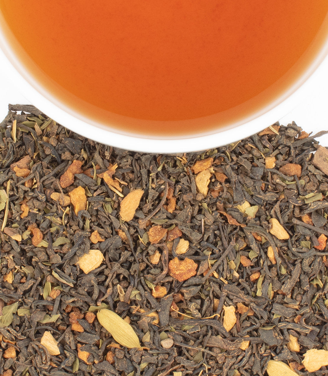 "Chocolate Cinnamint tea sachets with brewed tea in a cup, showcasing rich flavors and aromatic spices.