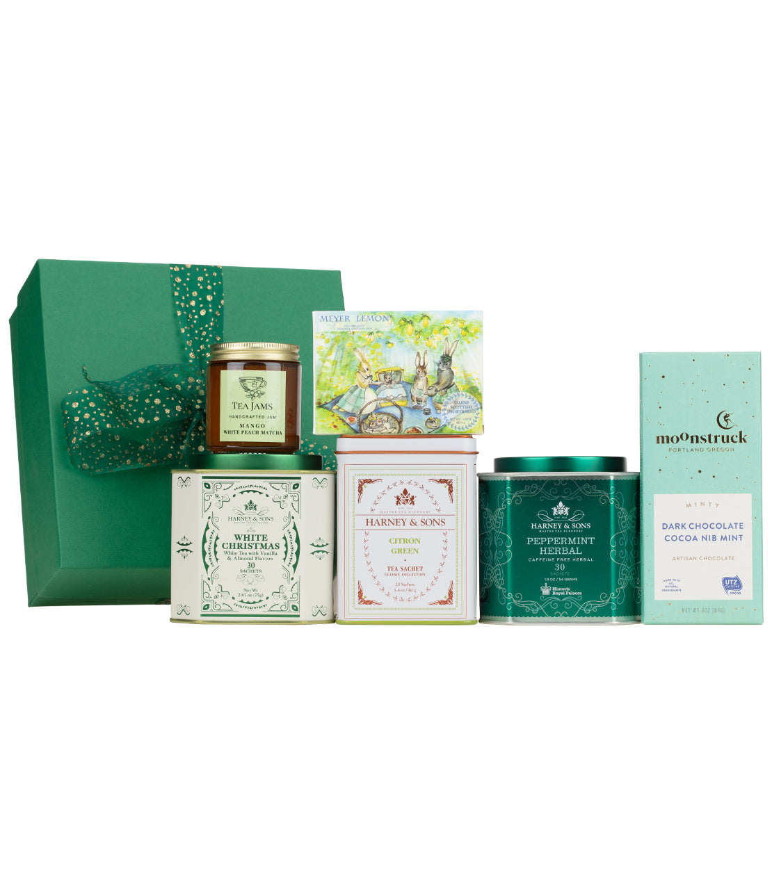 Green gift box with festive items including tea, cocoa, and a holiday card, perfect for Christmas gifting.