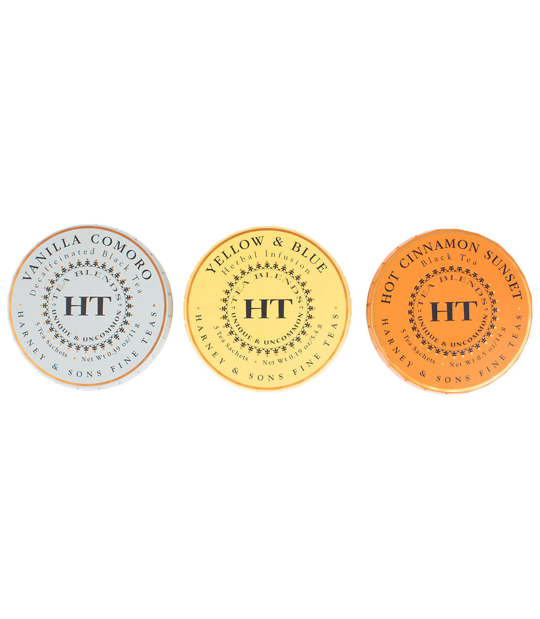 Harney & Sons Fine Teas- HT Tagalong Trio- Overhead shot of three HT Tagalong tins- Vanilla Comoro- Yellow & Blue- Hot Cinnamon Sunset