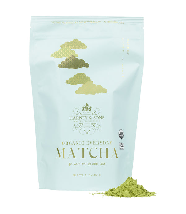 Harney & Sons Fine Teas- Organic Everyday Matcha powder  1LB Bag featuring a light blue design with gold accents- Pile of matcha powder pictured in front of bag