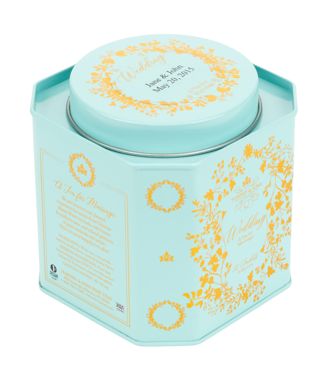 Harney & Sons Fine Teas- Personalized Wedding Tea Tin of 30 Sachets- A light blue hexagonal tea tin with gold floral designs and personalized wedding inscription.