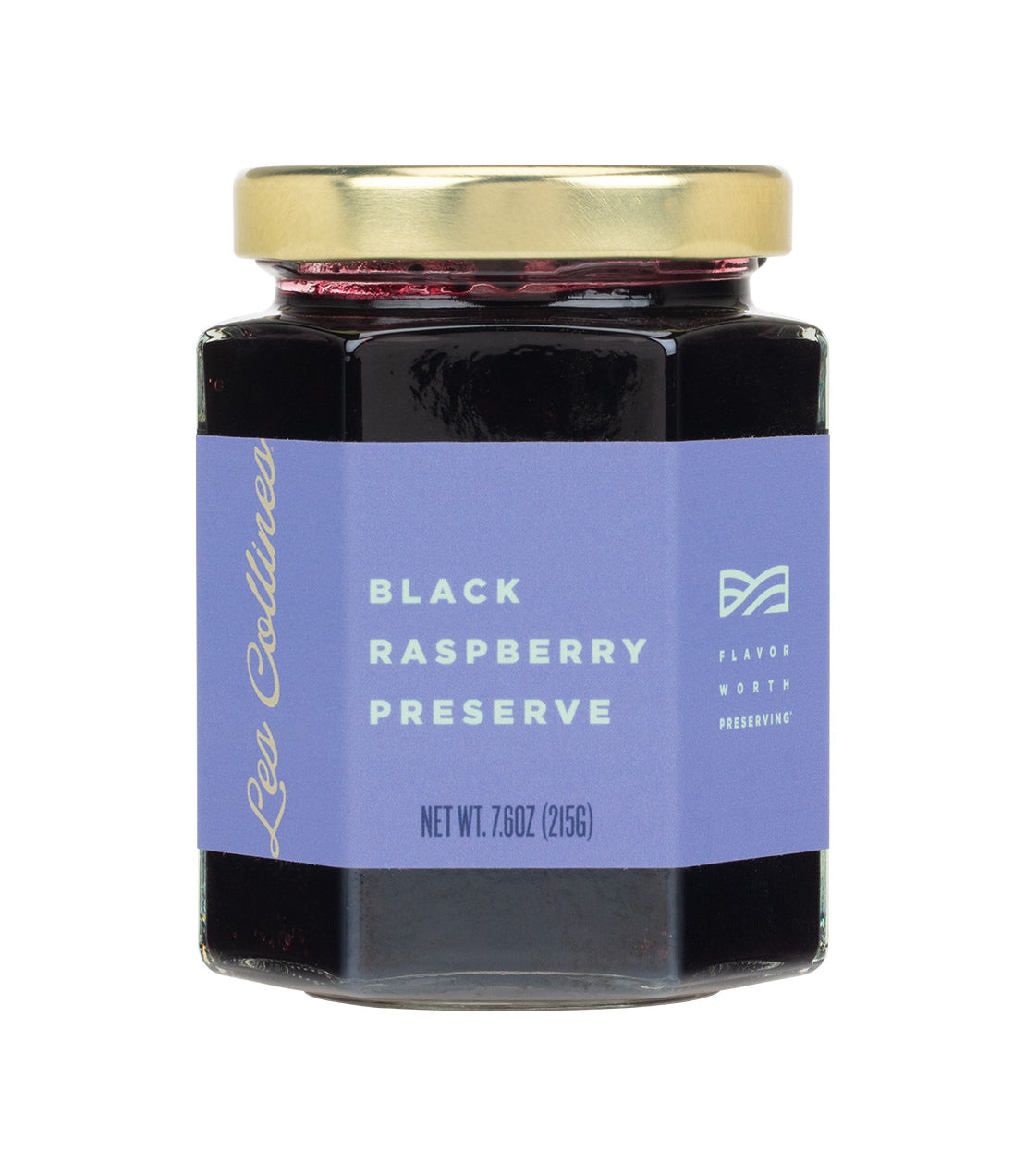 Les Collines Black Raspberry Preserve- A hexagonal glass jar with a gold lid contains black raspberry preserve, labeled with a purple sticker indicating the net weight as 7.6 oz (215g).