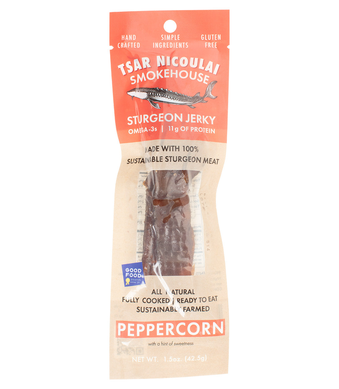 A package of Tsar Nicoletai Smokehouse Sturgeon Jerky in a clear bag with a peach and beige label, showing the jerky strips inside. The package highlights Omega-3 protein and peppercorn flavor.