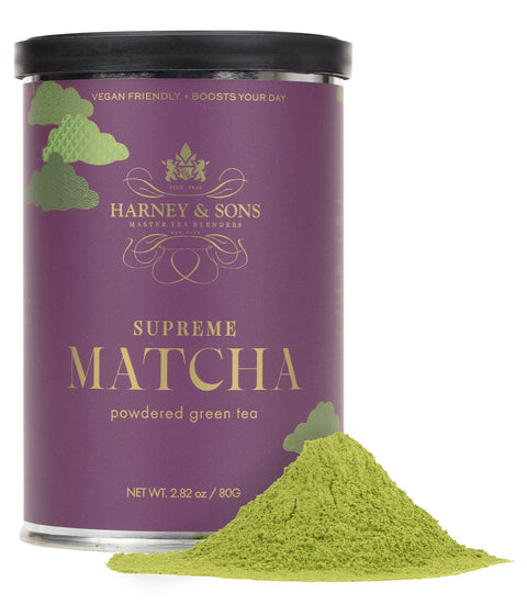 A purple canister of Harney & Sons Supreme Matcha powdered green tea with a mound of vibrant green matcha powder beside it.