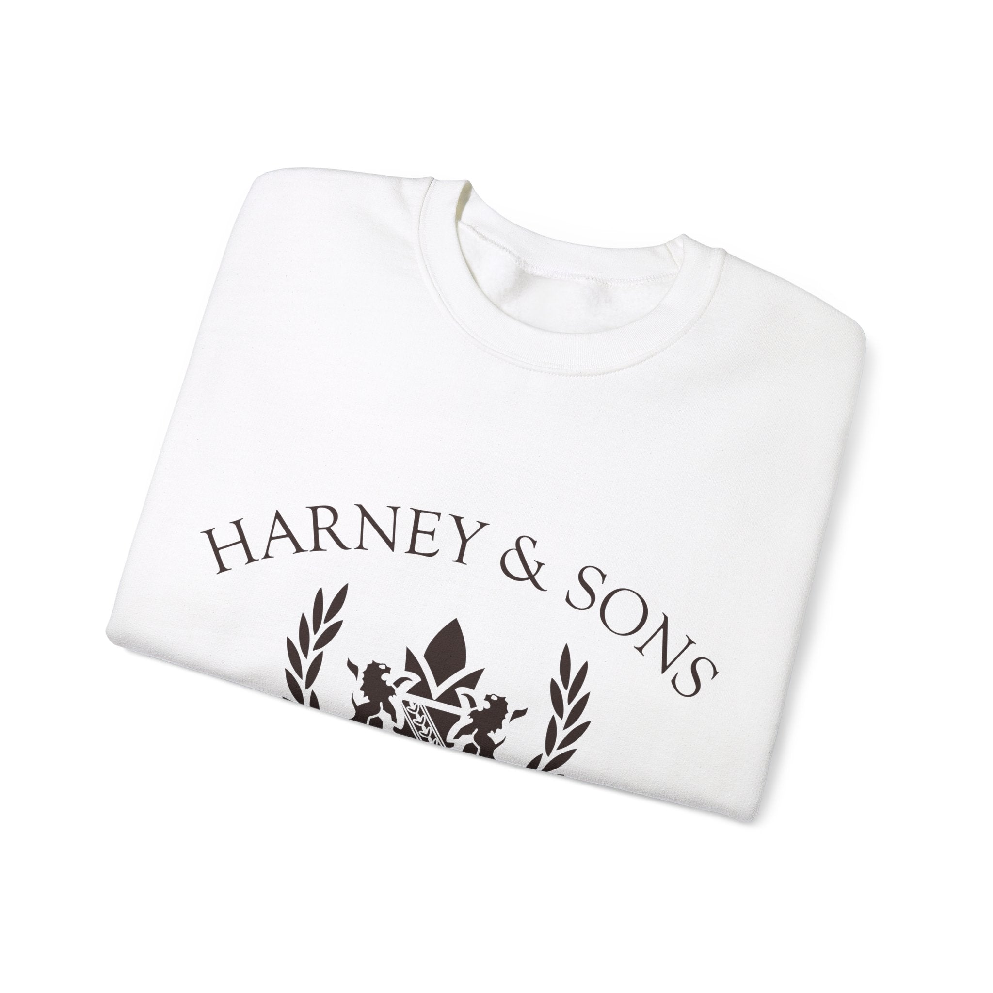 Unisex heavy blend crewneck sweatshirt in white featuring "Harney & Sons" logo and decorative design.