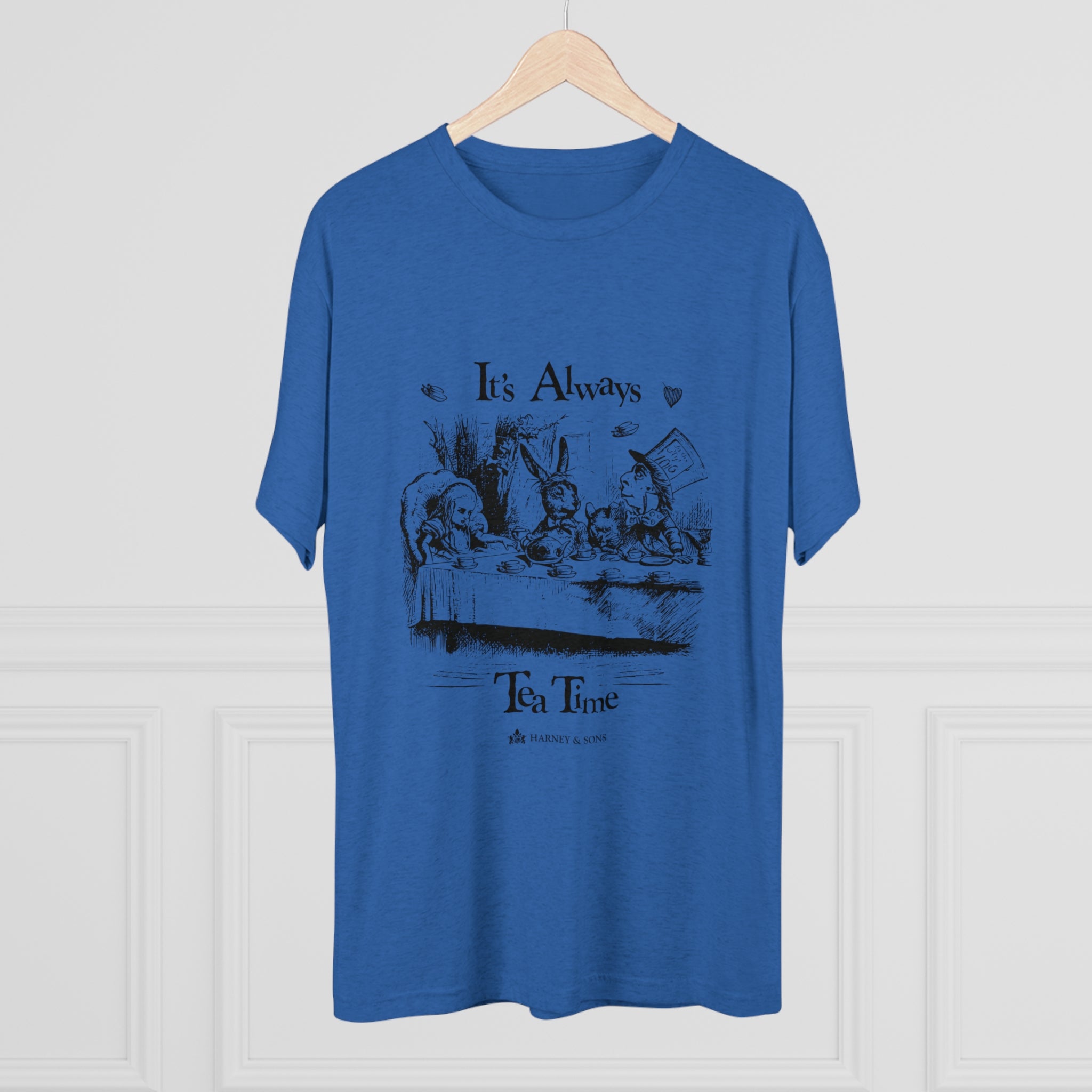 Blue graphic tee featuring the phrase "It's Always Tea Time" with an illustration of a whimsical tea party.