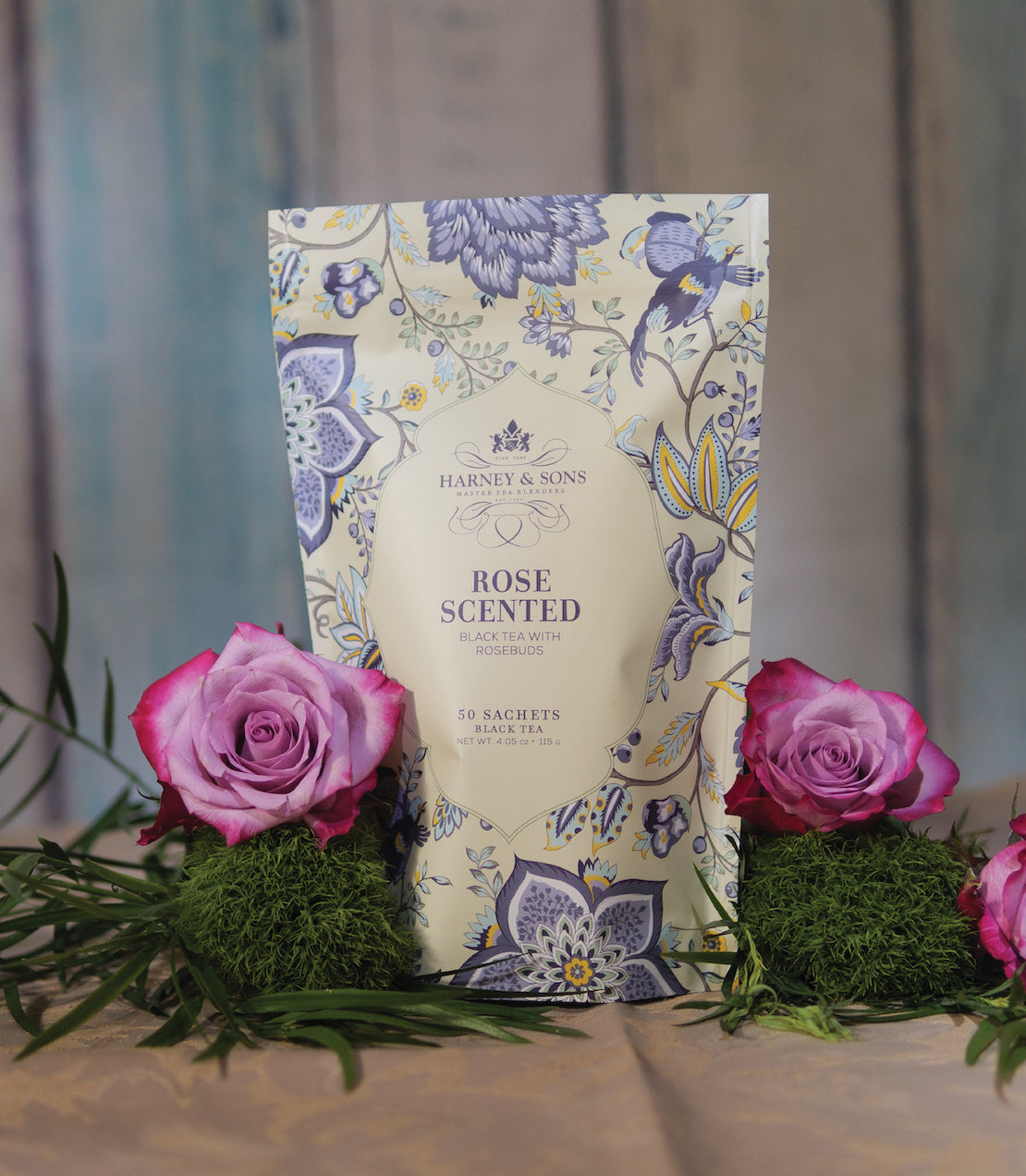 Harney & Sons Spring Bloom Trio featuring three bags of 50 sachets, with rose-scented tea and decorative flowers.