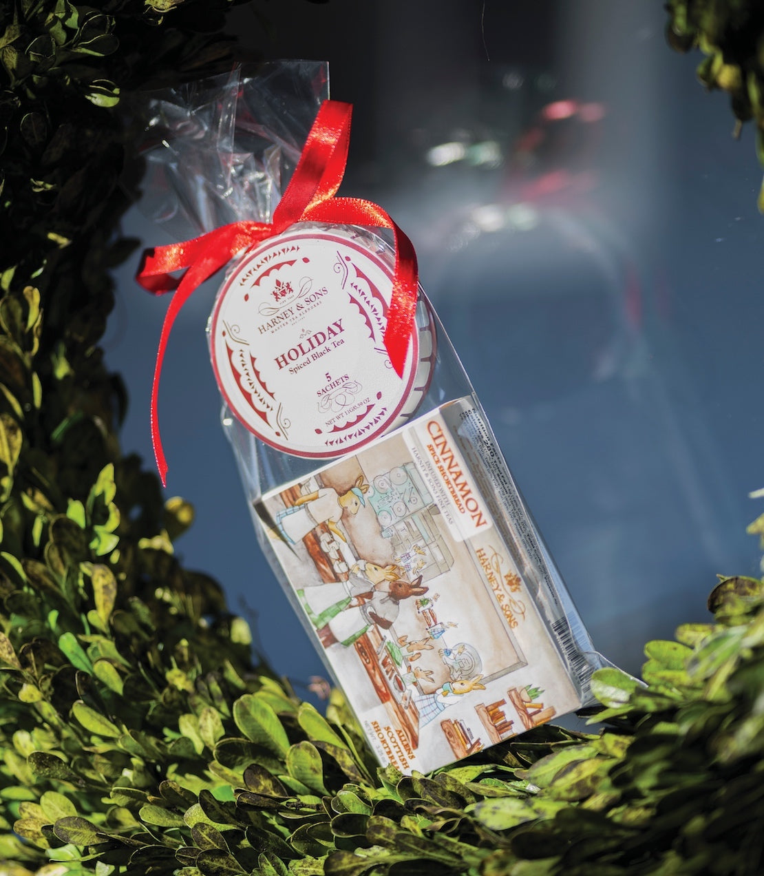 Festive stocking stuffer gift featuring cinnamon-scented treats in a clear bag with a red ribbon.