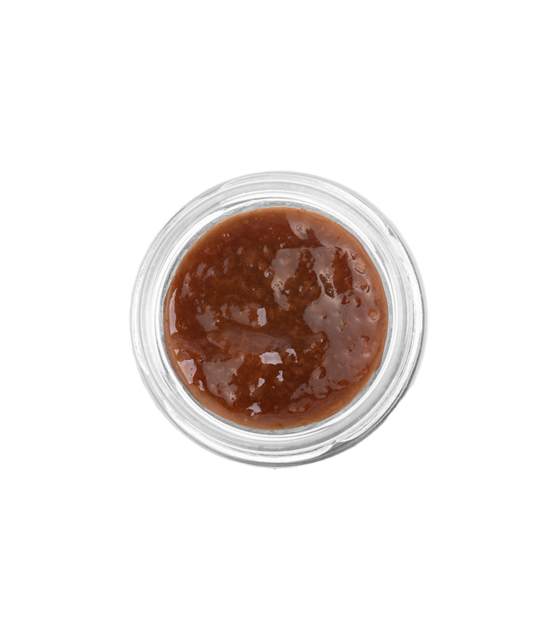 Assorted tea jams in a clear glass jar, showcasing a rich, glossy texture and deep brown color.