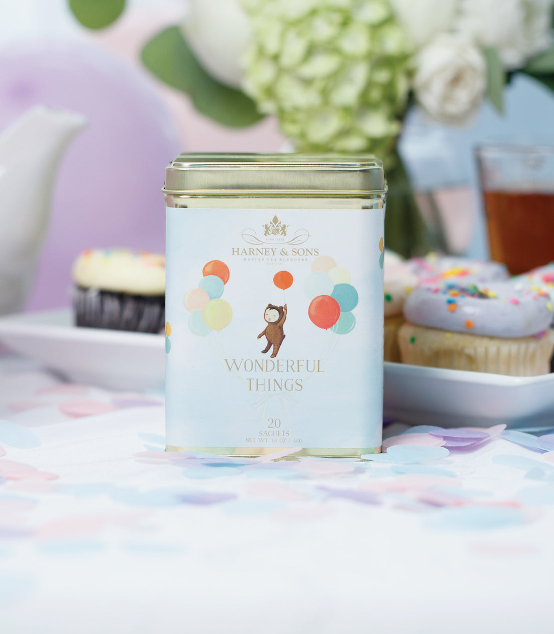 Tin of 20 sachets of "Wonderful Things" tea by Harney & Sons, featuring colorful balloons and a playful design.