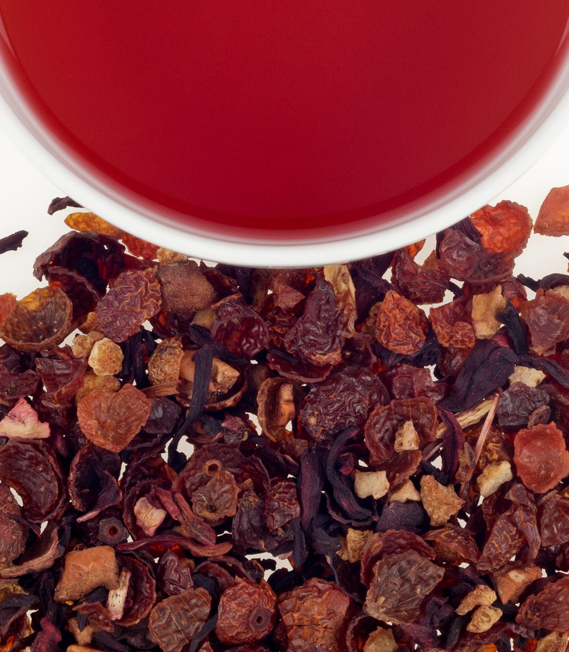 Goji berry fruit tea with dried goji berries and a vibrant red brew in a white cup.