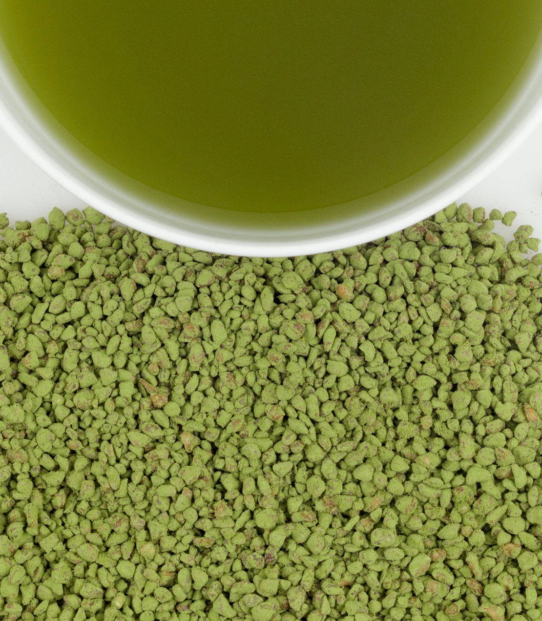 Roasted buckwheat matcha sachets with a bowl of vibrant green matcha tea. Perfect for a healthy beverage.