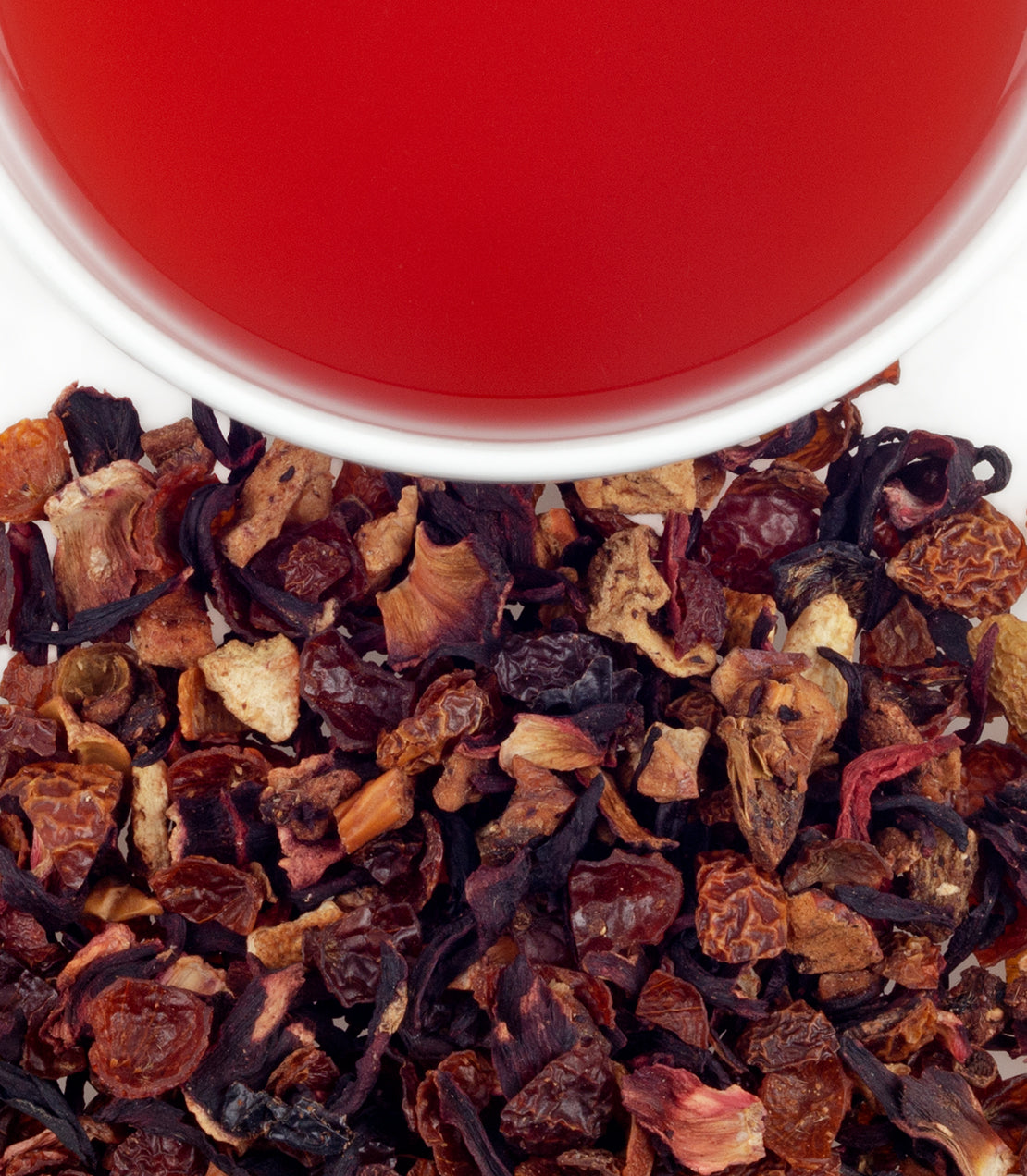 Strawberry Kiwi Fruit Tea sachets with dried fruit blend and brewed tea in a cup, perfect for refreshing beverages.