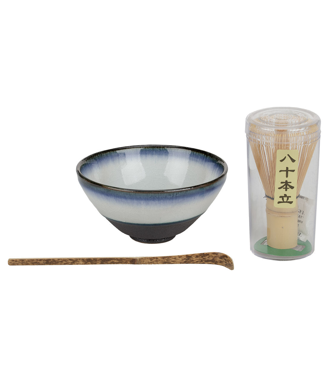 Assorted matcha set featuring a ceramic bowl, bamboo whisk, and bamboo scoop for preparing matcha tea.