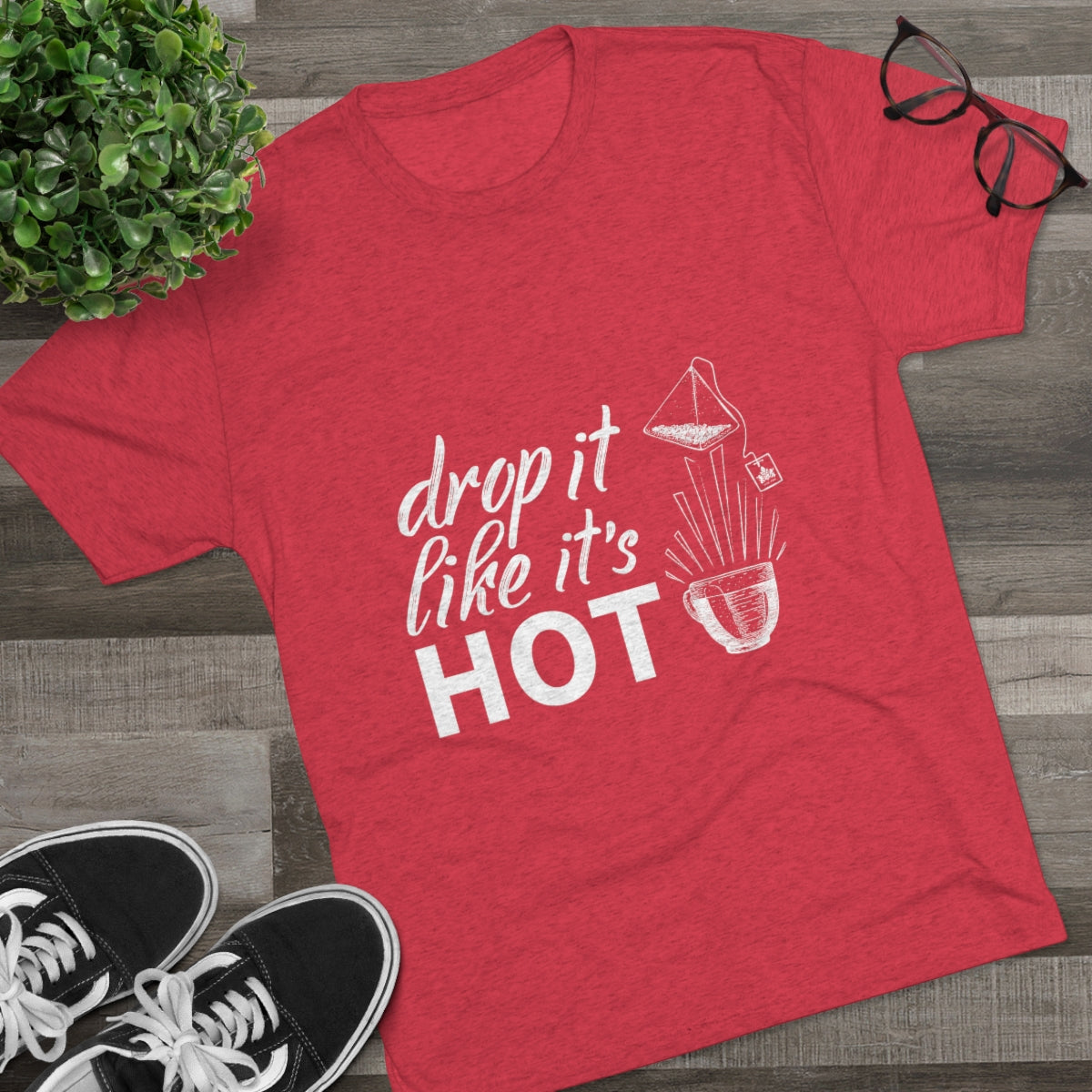 Red graphic tee featuring the phrase "drop it like it's HOT" with a coffee brewing illustration. Perfect for coffee lovers.