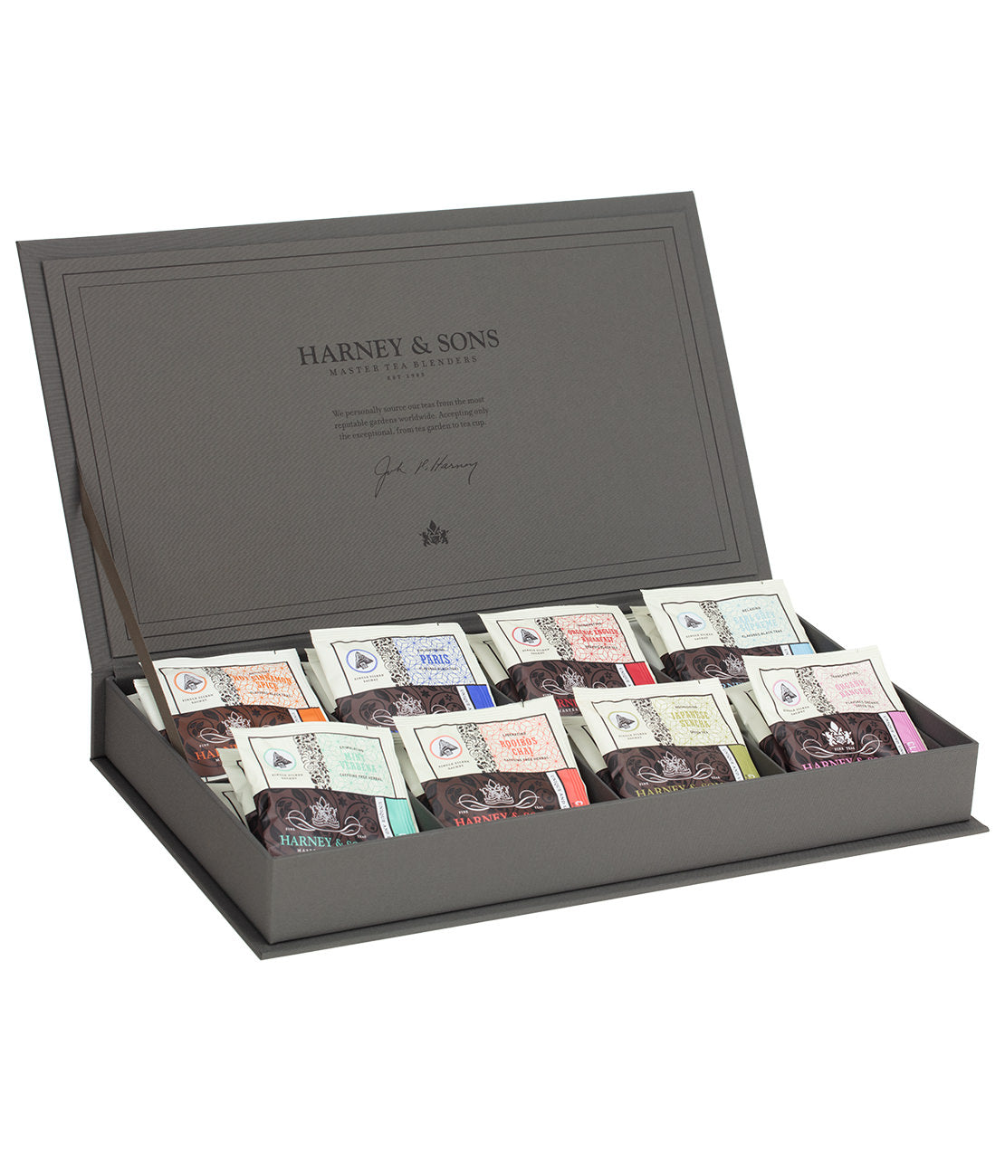 Elegant tea chest showcasing eight assorted teas in beautifully designed packets, perfect for tea enthusiasts.